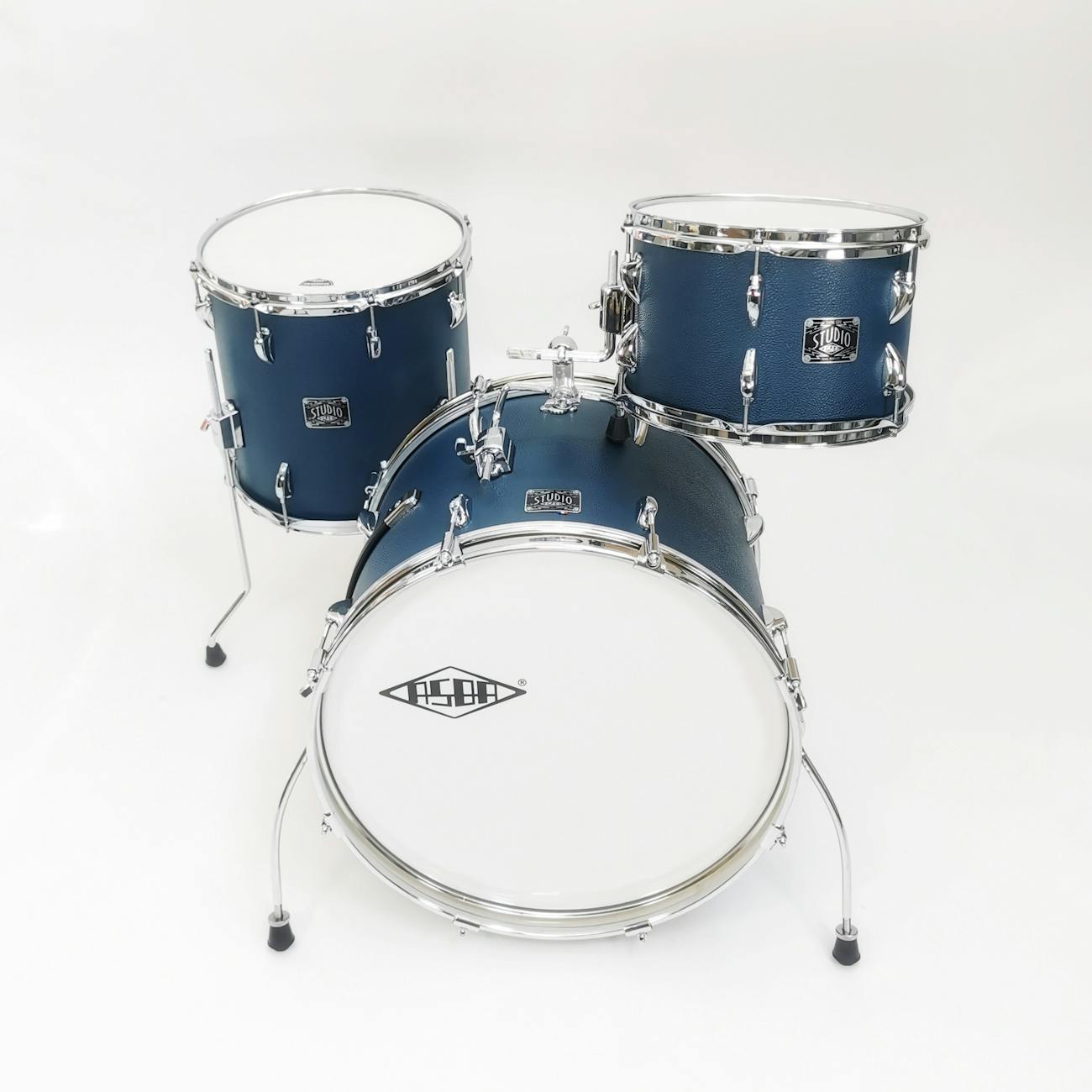 A blue drum set with chrome hardware on a clean white background, ideal for music enthusiasts.